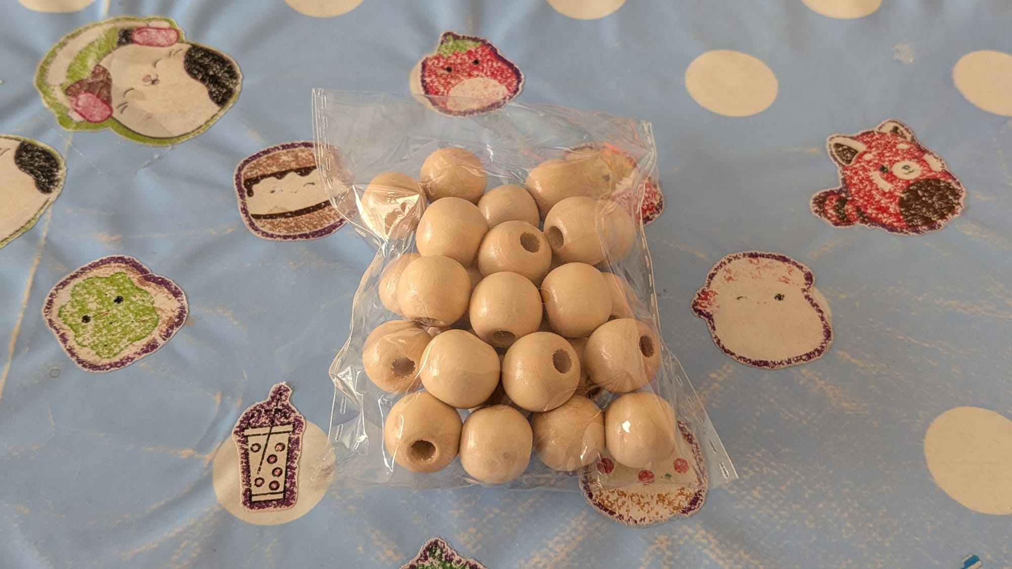 Beads in a bag, on a table.