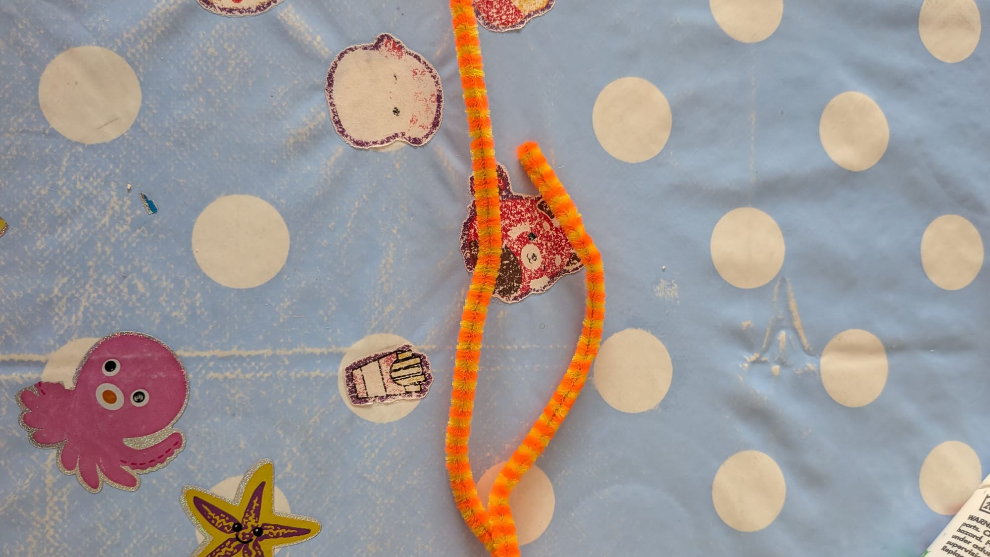 Orange and yellow pipe cleaner