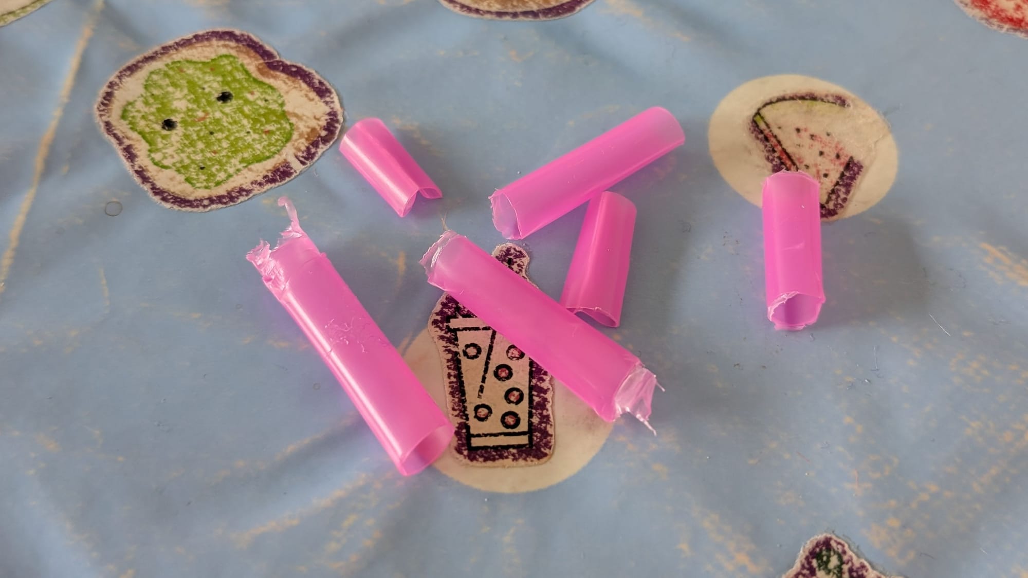 Pink bits of plastic straw